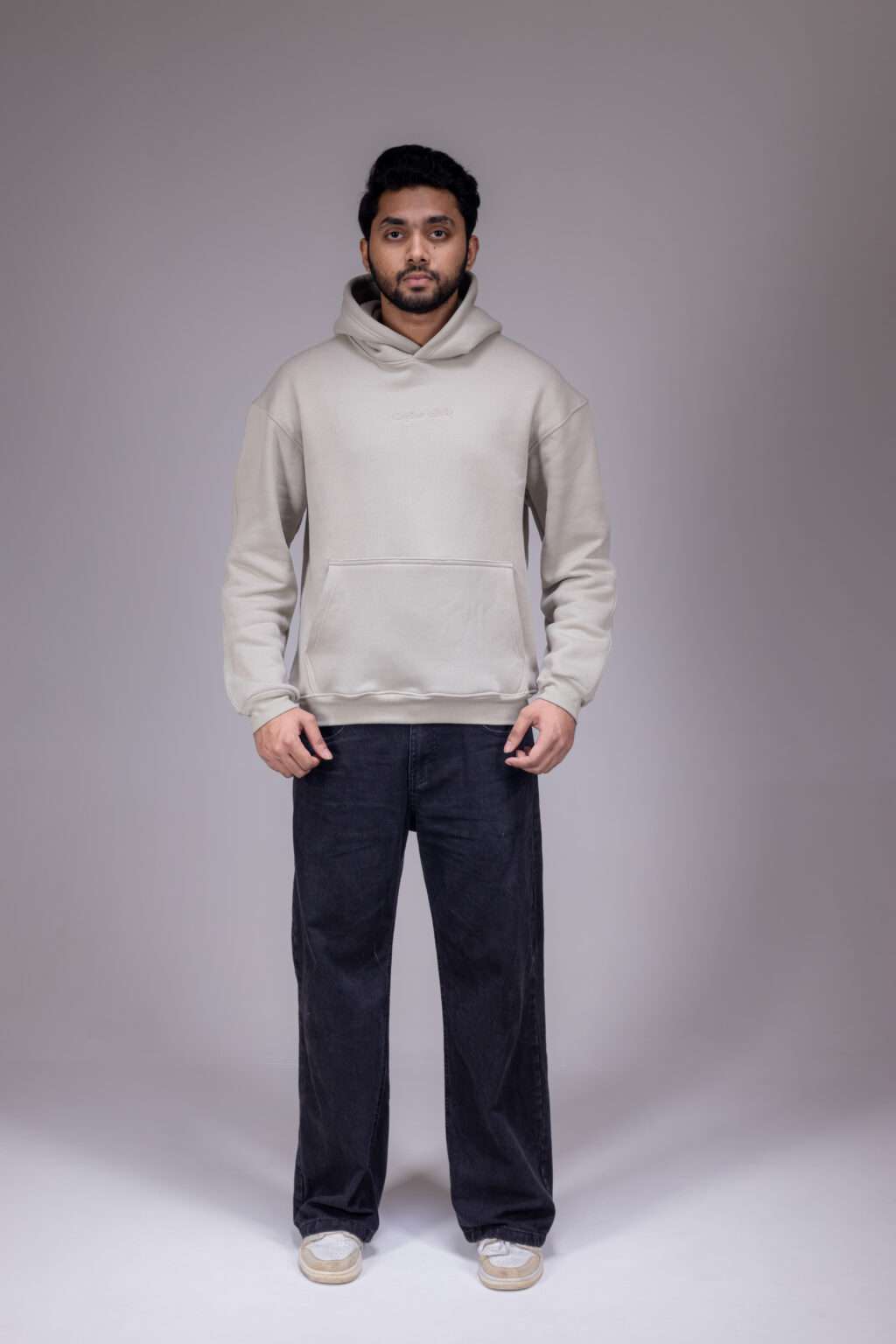 STATE ZERO Ivory White oversized hoodie with tonal Arabic chest embroidery and hood wordmark on pale bluish background