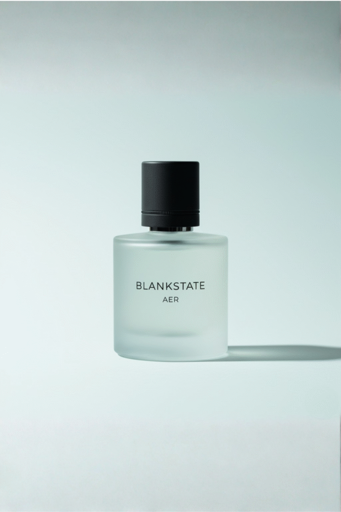 BLANKSTATE AER frosted perfume bottle on pale bluish background