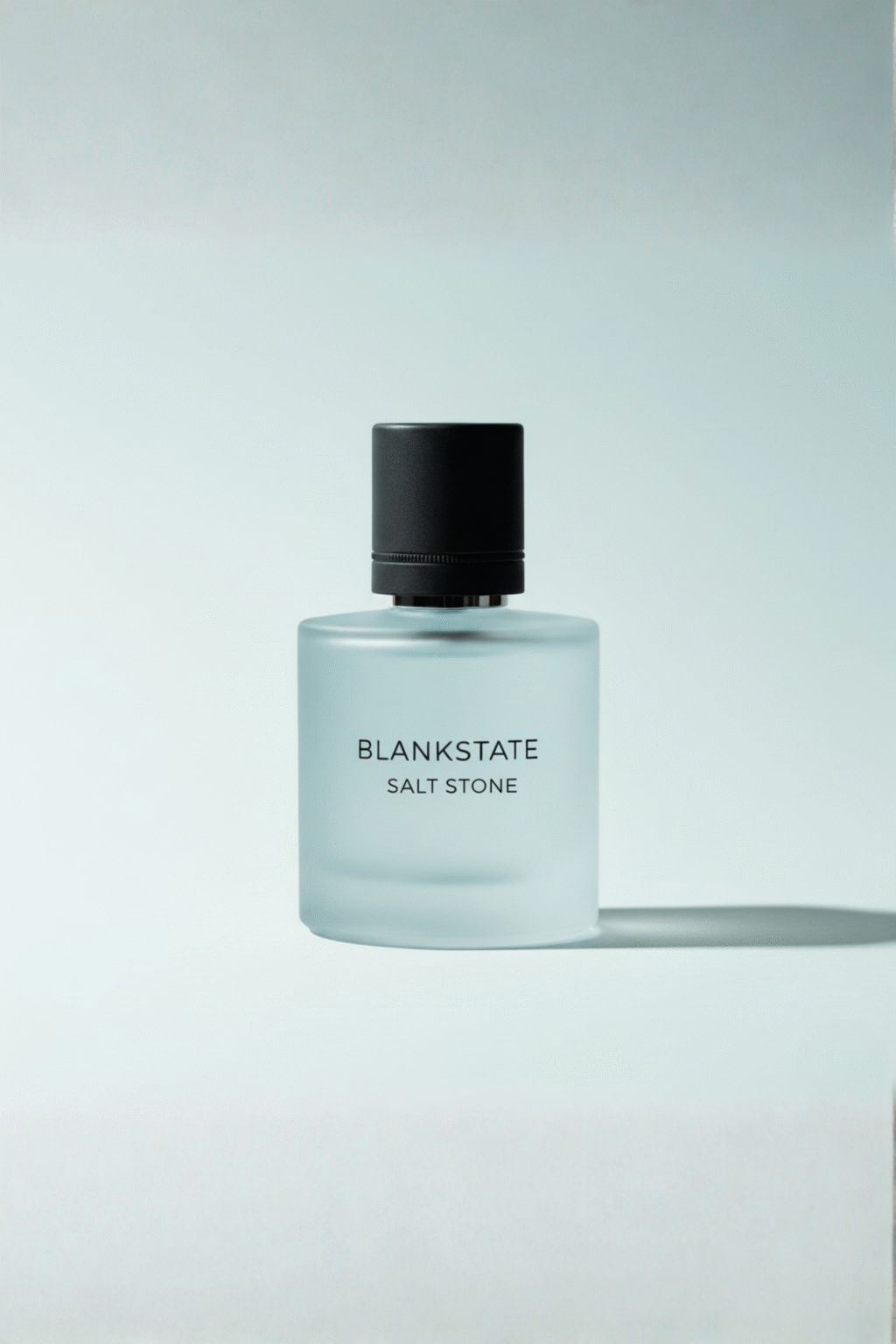BLANKSTATE SALT STONE frosted pale-blue tinted perfume bottle on pale bluish background